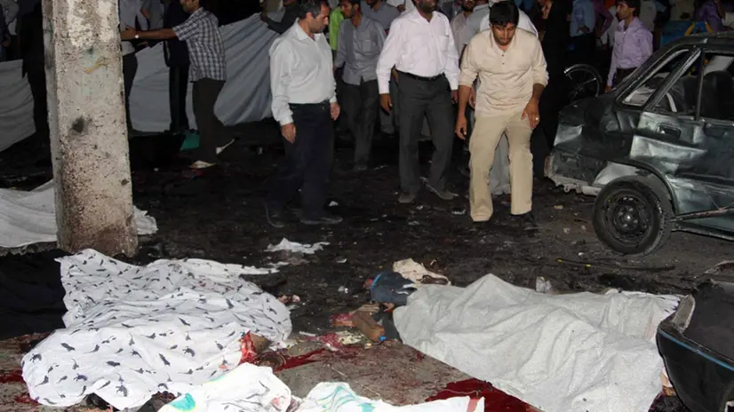 epa02249802 Bodies are strewn outside the Jameh mosque in the south-eastern Iranian city of Zahedan, Iran on 15 July 2010. At least 21 people, including members of the elite Revolutionary Guards, were killed and 100 wounded in two suicide attacks at a Shi'ite mosque in Zahedan. EPA/AMIR RASHEKI/IRNA ATTENTION EDITORS: PICTURE CONTAINS GRAPHIC CONTENT