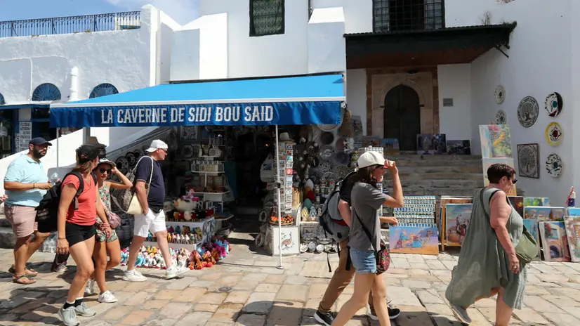 epa12212390 Tourists visit the village of Sidi Bou Said, a popular tourist destination, in Tunis, Tunisia, 03 July 2025. The Director General of the Tunisian National Tourism Office (ONTT), Mohamed Mehdi Haloui, told the media that the 2025 tourist season looks promising, with over 3.4 million tourists arriving in Tunisia between 01 January and 31 May—an increase of 10.2 percent compared to the same period in 2024. He added that if this growth continues, Tunisia could reach its target of 11 million visitors in 2025, up from 10.26 million in 2024. EPA/MOHAMED MESSARA