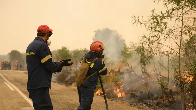 epa10830659 Firefighters operate during a wildfire in the area of Giannouli, Evros region, northern Greece, 31 August 2023. The Fire Brigade continues to battle fires in the wider area of Evros. Local authorities on 31 august ordered residents of Giannouli and Sidiro to evacuate due to flare-ups in the wider area. Assistance is provided by the European Civil Protection Mechanism with forces from France, Germany, Spain, Cyprus, Romania, Czech Republic, Bulgaria, Slovakia, Albania and Serbia. EPA/DIMITRIS ALEXOUDIS