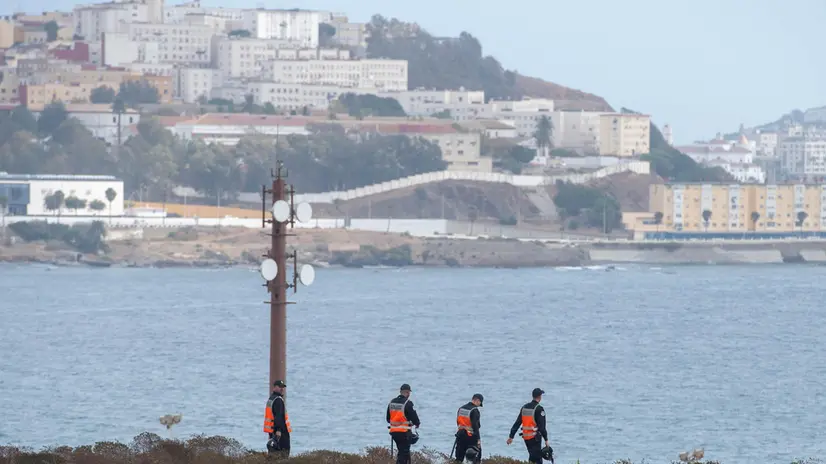 epa11633804 Members of the Moroccan national police forces patrol an area near a customs checkpoint along the land border from the Spanish enclave of Ceuta, in Fnideq, northern Morocco, 30 September 2024. The land border between Fnideq and Ceuta was stormed by hundreds of migrants on 15 September. Calls for another mass migration attempt on 30 September circulated on social media. EPA/JALAL MORCHIDI