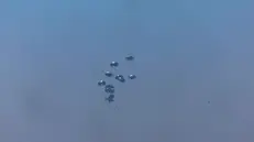 epa12265459 Humanitarian aid is airdropped over the northern part of the Gaza Strip by the Royal Jordanian Army, as seen from Sderot, southern Israel, 27 July 2025. More than 130 Palestinians, the majority of whom children, have died of malnutrition in the Gaza Strip, the Palestinian Ministry of Health said on 27 July. EPA/ATEF SAFADI