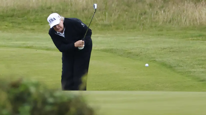 epa12265332 US President Donald J. Trump plays golf at Trump Turnberry golf course during a private visit in Turnberry, Scotland, Britain, 27 July 2025. US President Trump is in Scotland where he will visit his golf courses and meet with UK Prime Minister Keir Starmer. EPA/TOLGA AKMEN