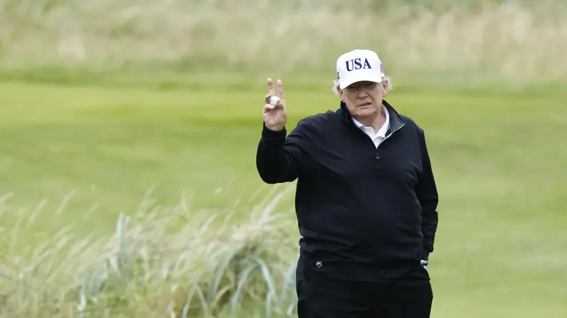 epa12265367 US President Donald J. Trump gestures as he speaks to the media while playing golf at Trump Turnberry golf course during a private visit in Turnberry, Scotland, Britain, 27 July 2025. US President Trump is in Scotland where he will visit his golf courses and meet with UK Prime Minister Keir Starmer. EPA/TOLGA AKMEN