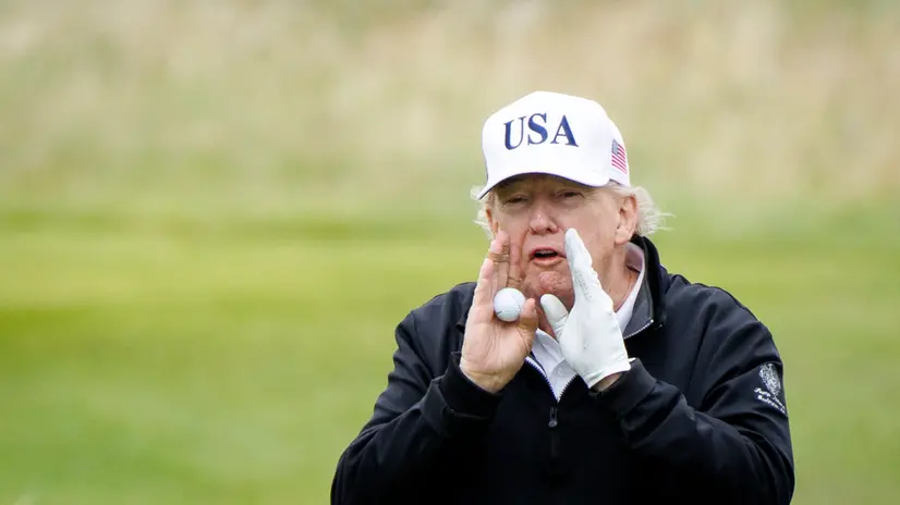 epa12265694 US President Donald J. Trump gestures as he speaks to the media while playing golf at Trump Turnberry golf course during a private visit in Turnberry, Scotland, Britain, 27 July 2025. US President Trump is in Scotland where he will visit his golf courses and meet with UK Prime Minister Keir Starmer. EPA/TOLGA AKMEN