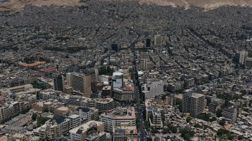 epa12242606 Aerial view of Damascus, Syria, 17 July 2025, a day after an Israeli airstrike on the Syrian Ministry of Defence building, following the deployment of Syrian troops in the predominantly Druze province of Suwayda (Sweida), after clashes between Druze fighters and Bedouin tribes resulted in the death of dozens of people. EPA/AHMAD FALLAHA