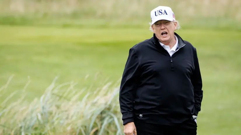 epa12265586 US President Donald J. Trump speaks to the media while playing golf at Trump Turnberry golf course during a private visit in Turnberry, Scotland, Britain, 27 July 2025. US President Trump is in Scotland where he will visit his golf courses and meet with UK Prime Minister Keir Starmer. EPA/TOLGA AKMEN