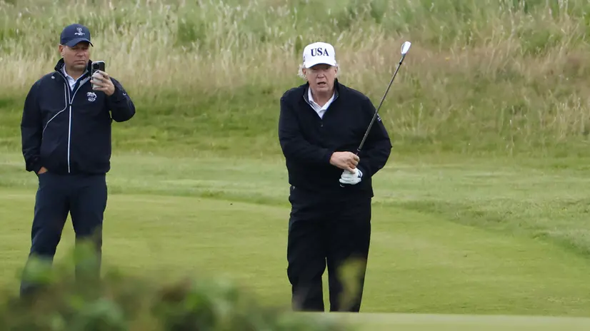 epa12265334 US President Donald J. Trump (R) plays golf at Trump Turnberry golf course during a private visit in Turnberry, Scotland, Britain, 27 July 2025. US President Trump is in Scotland where he will visit his golf courses and meet with UK Prime Minister Keir Starmer. EPA/TOLGA AKMEN