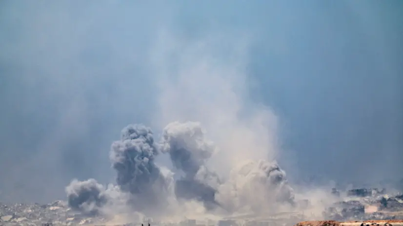 epa12265524 Smoke rises from an Israeli airstrike in the northern part of the Gaza Strip near Beit Hanoun, as seen from the Israeli side of the border, 27 July 2025. EPA/ATEF SAFADI