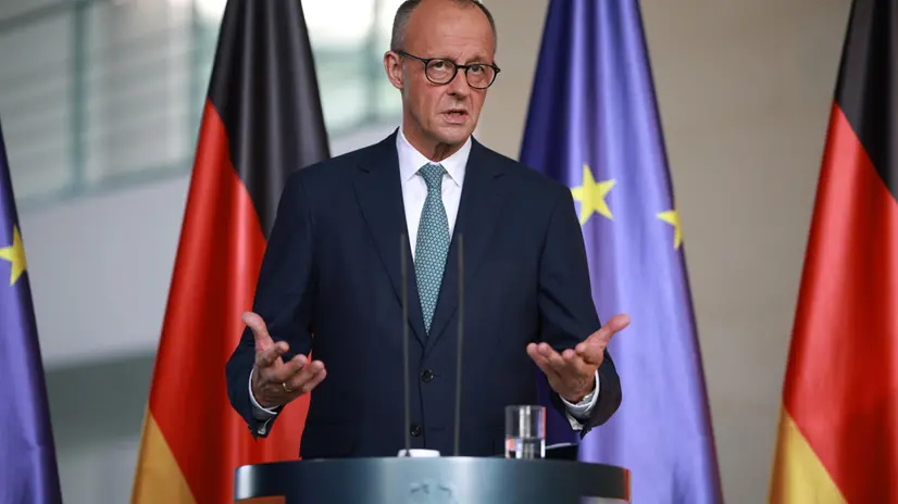 epa12268943 German Chancellor Friedrich Merz delivers a statement at the chancellery following a meeting of the government's security cabinet in Berlin, Germany, 28 July 2025. EPA/CLEMENS BILAN