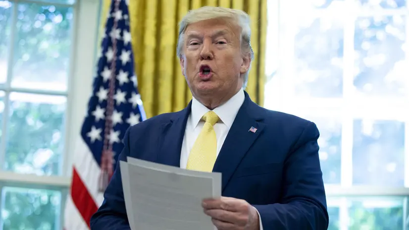 epa07914319 US President Donald J. Trump holds a letter presented to him by President of China Xi Jinpping during his meeting on trade negotiations with Vice Premier of China Liu He (not pictured), in the Oval Office of the White House in Washington, DC, USA, 11 October 2019. Trump announced they 'have come to a very substantial phase one deal' as part of a multiphase trade deal while meeting with Liu on the second day of a new round of face-to-face trade negotiations between high level Chinese and American officials. The US agreed to hold off on increasing tarrifs set to begin 15 October and China has agreed to increase its purchase of US agricultural products. EPA/MICHAEL REYNOLDS