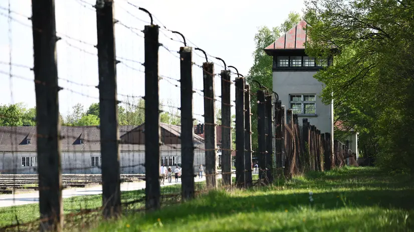 epa12063177 A guard tower on the perimeter at the former Dachau concentration camp before a memorial event at marking the 80th anniversary of the camp's liberation in Dachau Germany, 29 April 2025. Dachau concentration camp was liberated by U.S. Armed Forces on 29 April 1945. The concentration camp was established on 22 March 1933 for political prisoners and it served as a model for all later concentration camps. Over 200,000 people from all over Europe were imprisoned and more than 43,00 were murdered. EPA/ANNA SZILAGYI
