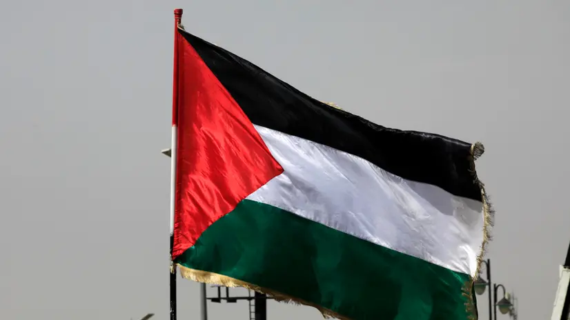 epa12245732 A Palestinian flag flutters during a protest against the US and Israel, in Sana'a, Yemen, 18 July 2025. Houthi supporters demonstrated in Sana'a against the US and Israel for continuing the military campaign in the Gaza Strip. Houthi leader Abdul-Malik al-Houthi has claimed that his forces had fired 11 hypersonic missiles and drones at Israel in the past week, vowing more attacks against Israel-linked ships in the seas around Yemen as part of support for the Palestinian people in Gaza. EPA/YAHYA ARHAB