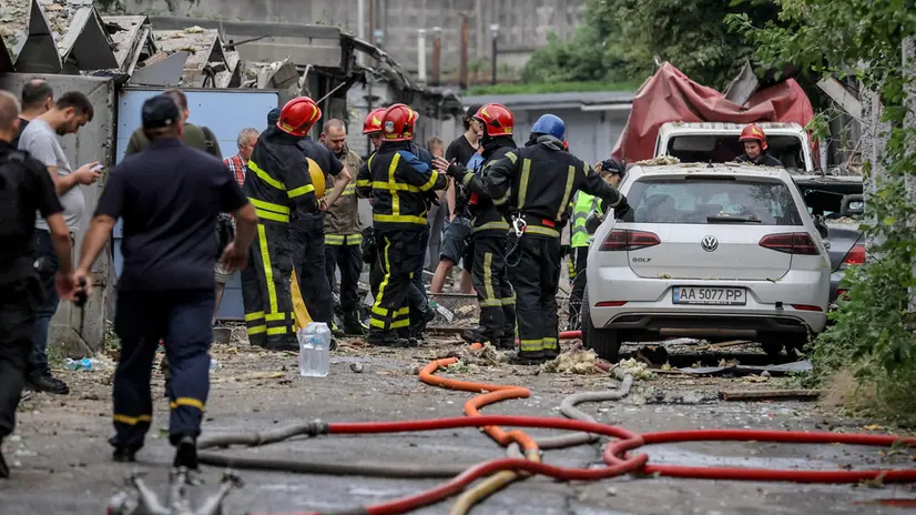 epa10827953 Firefighters work at the site of missile strike in Kyiv, Ukraine, 30 August 2023. Russian forces attacked Kyiv the night of 30 August 2023 killing two people and injuring another, Kyiv City Military Administration Head Serhii Popko reported. EPA/OLEG PETRASYUK