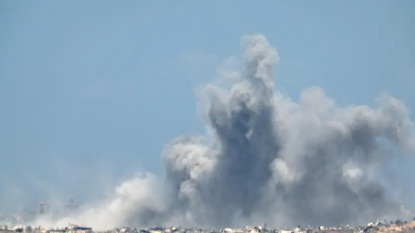 epa12274533 Smoke rises following an Israeli airstrike in the northern Gaza Strip, as seen from the Israeli side of the border, 31 July 2025. EPA/ATEF SAFADI