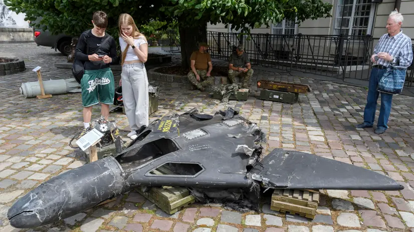 epa12201173 People look at defused Russian weapons of various types which were used by Russia during fighting for the Donetsk area, at an open-air exhibition in Lviv, Ukraine, 27 June 2025. The open-air exhibition was organized by servicemen of the 24th Mechanized Brigade named after King Danylo and shows the artifacts of war, like defused Russian bombs and drones of various types. EPA/MYKOLA TYS 89473