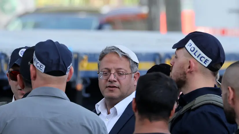 epa11686483 Minister of National Security of Israel, Itamar Ben Gvir (C), looks on at the scene of a truck ramming outside the Glilot military base near Tel Aviv, Israel, 27 October 2024. According to the police spokesperson's unit, a truck rammed into and collided with a bus stopping to drop off passengers at the Gilot base station. Magen Davon Adom, Israel's emergency services, reports at least 24 people were injured in the incident. The circumstances of the incident are currently under investigation. EPA/ABIR SULTAN