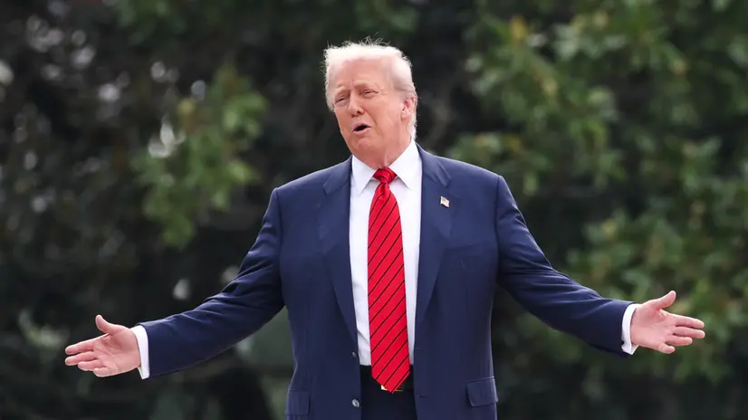 epa12284466 US President Donald J. Trump responds to a question from the news media as he tours the roof at the White House in Washington, DC, USA, 05 August 2025. President Trump has announced the construction of a new ballroom addition of approximately 90,000 total square feet of ornately designed and carefully crafted space, with a seated capacity of 650 people. EPA/SAMUEL CORUM / POOL