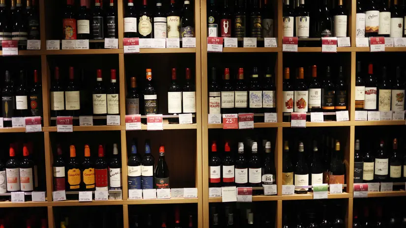epa10779930 Wine is displayed for sale in a store in London Britain, 01 August 2023. The UK government is now taxing all alcohol based on its strength, rather than the previous categories of wine, beer, spirits, and ciders. The increase will see duty rise by 44p on a bottle of wine, a bottle of gin or vodka will rise by about 90p. Duty on draught pints across the UK will be cut by 11p. EPA/NEIL HALL