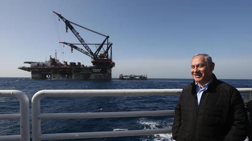 epa07333901 Israeli Prime Minister Benjamin Netanyahu at the Leviathan gas platform of Noble Energy at the Mediterranean Sea, some 10km from the Israeli coast, 31 January 2019, after the foundations of a 98-meter-tall and 15,500-ton-weighing metal structure (behind C) were lowered onto the sea bed from aboard a large barge late 30 January 2019. The platform will have its top structures installed during the 2nd half of 2019 and tested before the planned start of delivery of gas to Israeli customers at the end of 2019. EPA/MARC ISRAEL SELLEM / POOL