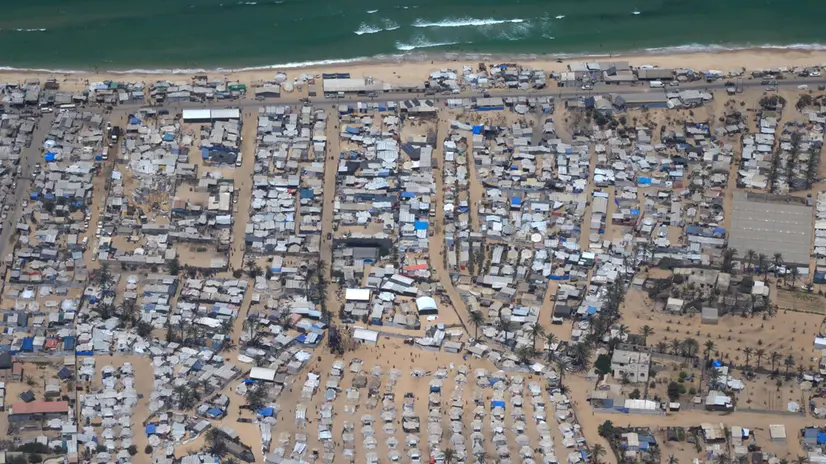 epa12286054 Tents of internally displaced Palestinians in Al Mawasi, Gaza Strip, as seen from a German Air Force plane airdropping humanitarian aid, 06 August 2025. Two planes were scheduled to take off from Jordan on 06 August to release approximately 22 tons of humanitarian aid over Gaza, bringing the total to over 90 tons dropped by Germany across several flights so far, as part of an ongoing multi-country aid effort expected to continue for another three weeks, the German chancellor announced. EPA/SIMA DIAB