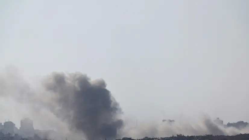 epa12288703 Smoke rises as a result of an explosion in the northern part of the Gaza Strip, as seen from the Israeli side of the border with Gaza, in southern Israel, 07 August 2025 EPA/ATEF SAFADI