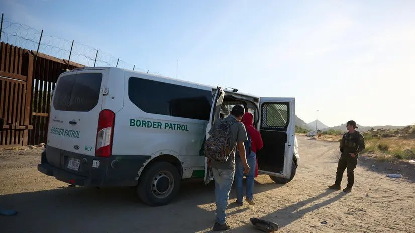 epa11390423 Migrants board a van for US Border Patrol after crossing the US Mexico border in Jacumba, California, USA, 04 June 2024. Today, US President Joe Biden signed an executive order tightening restrictions on migrants seeking asylum at the US Mexico border. The order is expected to go into effect immediately. EPA/ALLISON DINNER