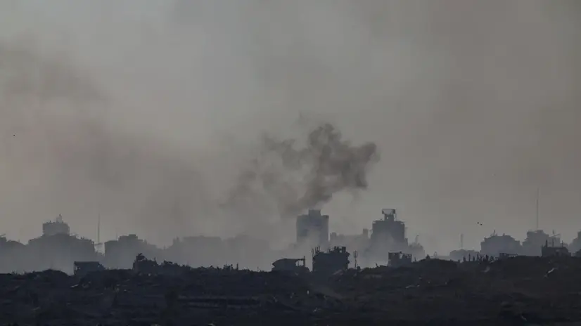 epa12288704 Smoke rises as a result of an explosion in the northern part of the Gaza Strip, as seen from the Israeli side of the border with Gaza, in southern Israel, 07 August 2025 EPA/ATEF SAFADI