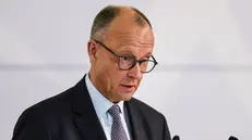 epa12284154 German Chancellor Friedrich Merz speaks during a ceremony of '75th anniversary of the Charter of German Expellees - Homeland Day 2025' in Stuttgart, Germany, 05 August 2025. EPA/RONALD WITTEK
