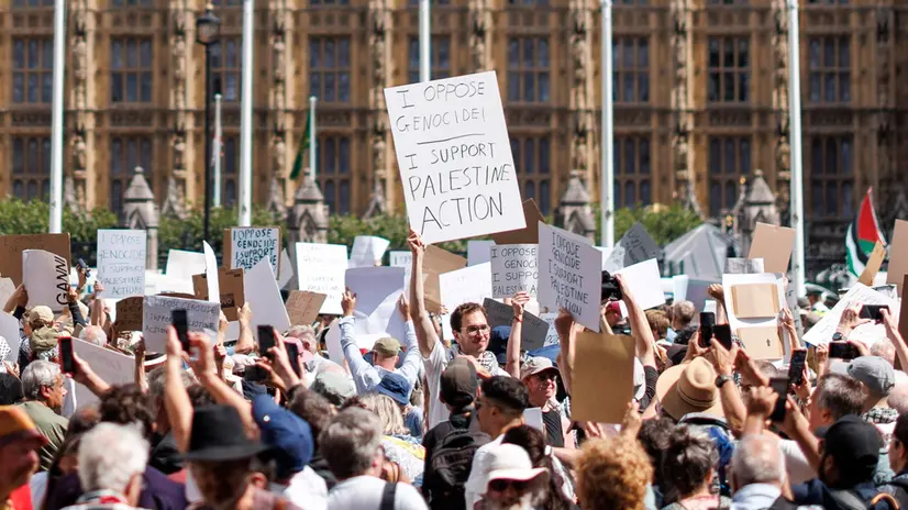 epa12291355 Supporters of Palestine Action attend a mass protest organized by the Defend Our Juries group as part of their campaign to end the proscription of Palestine Action, in Parliament Square, London, Britain, 09 August 2025. Palestine Action group was banned under terrorism law in the UK after activists allegedly broke into RAF Brize Norton military base in Oxfordshire in June 2025 and caused about 7 million GBP damage to British military planes. EPA/TOLGA AKMEN