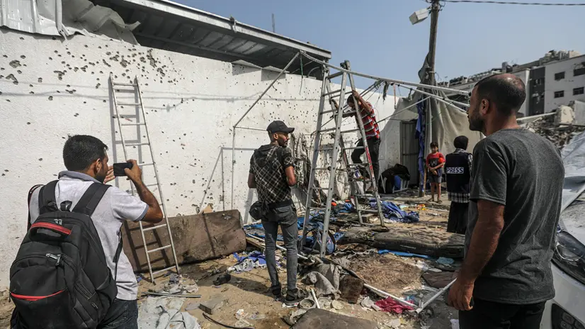 epa12293392 Palestinians inspect the destroyed tent of the Al Jazeera team following an Israeli strike, outside the Al-Shifa Hospital in Gaza City, 11 August 2025. At least seven people, including five Al Jazeera media team members Anas Al-Sharif, Mohammed Qreiqeh, Ibrahim Zaher, Moamen Aliwa and Mohammed Noufal, were killed in an Israeli strike on their tent outside Gaza's Al-Shifa Hospital late 10 August 2025. The Israel Defense Forces (IDF) claimed direct responsibility for the attack. EPA/MOHAMMED SABER
