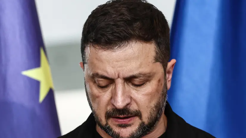 epa12297938 Ukrainian President Volodymyr Zelensky attends a press conference with German Chancellor Merz (unseen) after a video call with other heads of state ahead of a summit between the US and Russian leaders, in Berlin, Germany, 12 August 2025 EPA/FILIP SINGER