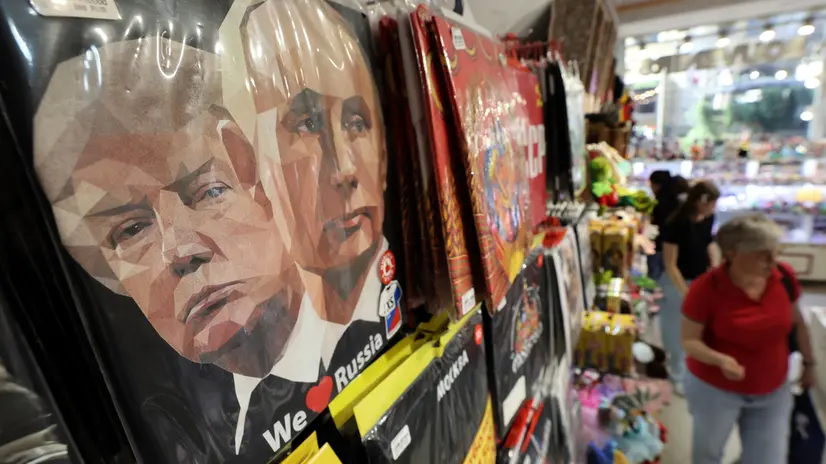epa12298132 A t-shirt featuring portraits of Russian President Putin (R) and US President Trump (L) is on display for sale at a souvenir market in Moscow, Russia, 13 August 2025. A meeting in Alaska, USA of Putin and Trump is scheduled for 15 August 2025. EPA/MAXIM SHIPENKOV