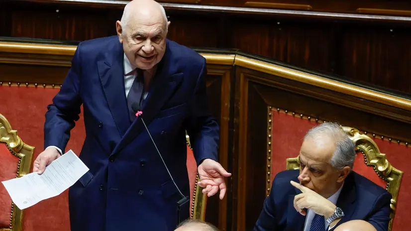 Italy's Justice Minister Carlo Nordio (L) and Interior Minister Matteo Piantedosi react during a government briefing over the case of Libyan General Osama Najim Almasri, at the Senate, Rome, Italy, 05 February 2025. On 21 January the Italian government released and repatriated Almasri after a brief detention over an International Criminal Court (ICC) arrest warrant. The general is wanted by the ICC over allegations of war crimes and crimes against humanity. ANSA/FABIO FRUSTACI