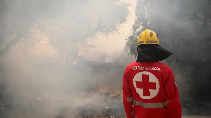epaselect epa12297497 A member of Hellenic Red Cross tries to extinguish a wildfire in Vounteni village ,Achaia, Peloponnese, Greece, 13 August 2025. The wildfires in the Syhena area of Patras and in Western Achaia continued to burn unchecked on Wednesday. In Western Achaia, the fire was also ongoing, with strong firefighting forces battling the flames. In total, 165 firefighters, five ground teams, and 51 fire engines were operating in the area. EPA/GIOTA LOTSARI
