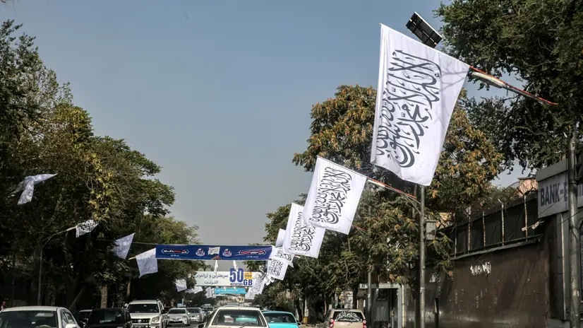 epa12298609 Cars drive along a road lined with flags of the Islamic Emirate of Afghanistan installed ahead of the fourth anniversary of the Taliban takeover, in Kabul, Afghanistan, 13 August 2025. The Taliban government on 15 August marks the fourth year since its return to power in 2021, ending a major offensive which followed the withdrawal of US troops from the country. The takeover has resulted, among other things, in a reversal of women's rights, as well as the country becoming isolated internationally. EPA/SAMIULLAH POPAL