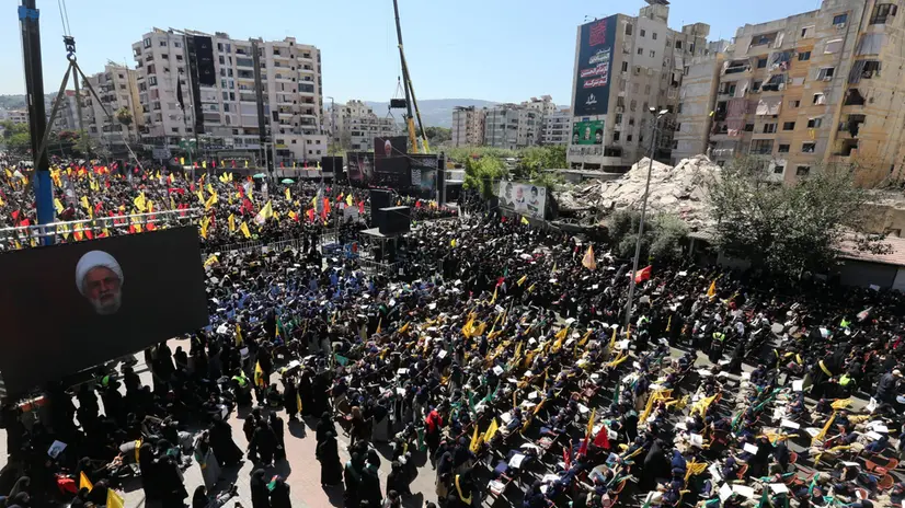 epa12219669 Supporters of Hezbollah watch a televised address by Hezbollah leader Sheikh Naim Qassem during Ashura Day celebrations in southern Beirut, Lebanon, 06 July 2025. Shiite Muslims across the world are observing the holy month of Muharram, the first month of the Islamic calendar, which culminates with the celebration of the Ashura, commemorating the martyrdom of Imam Hussein, a grandson of the Prophet Muhammad. EPA/WAEL HAMZEH