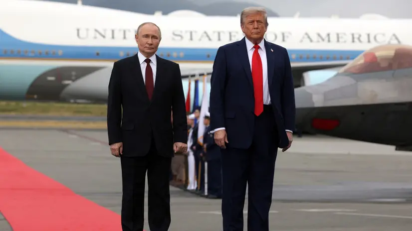 epa12303628 US President Donald Trump (R) and Russian President Vladimir Putin pose on the podium on the tarmac after they arrived to attend a meeting at Joint Base Elmendorf-Richardson in Anchorage, Alaska, USA, 15 August 2025. EPA/GAVRIIL GRIGOROV/SPUTNIK/KREMLIN POOL / POOL MANDATORY CREDIT