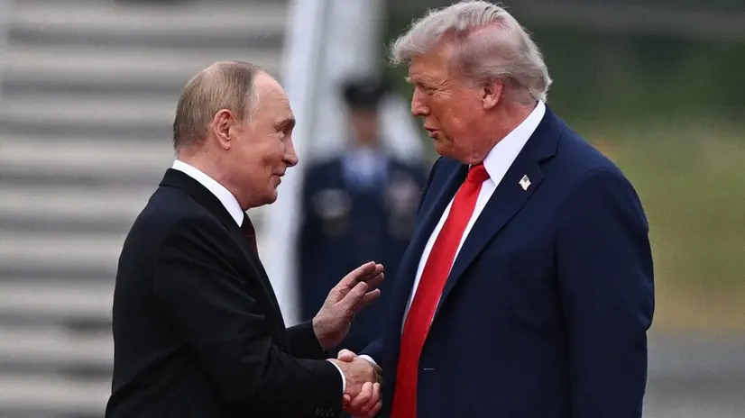 epa12303499 US President Donald Trump (R) welcomes Russian President Vladimir Putin, as they meet to negotiate at Joint Base Elmendorf-Richardson in Anchorage, Alaska, USA, 15 August 2025. EPA/SERGEY BOBYLEV/SPUTNIK/KREMLIN POOL / POOL MANDATORY CREDIT