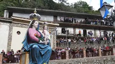 epa02313163 People attend the 'Madonna della Montagna' procession to the Sanctuary of Our Lady of Polsi in the Aspromonte mountains, near San Luca, Calabria, Italy, 02 September 2010. Thousands of pilgrims take part in the journey to the sanctuary for the Madonna's feast days from the 1st to the 3rd of September. EPA/FRANCO CUFARI