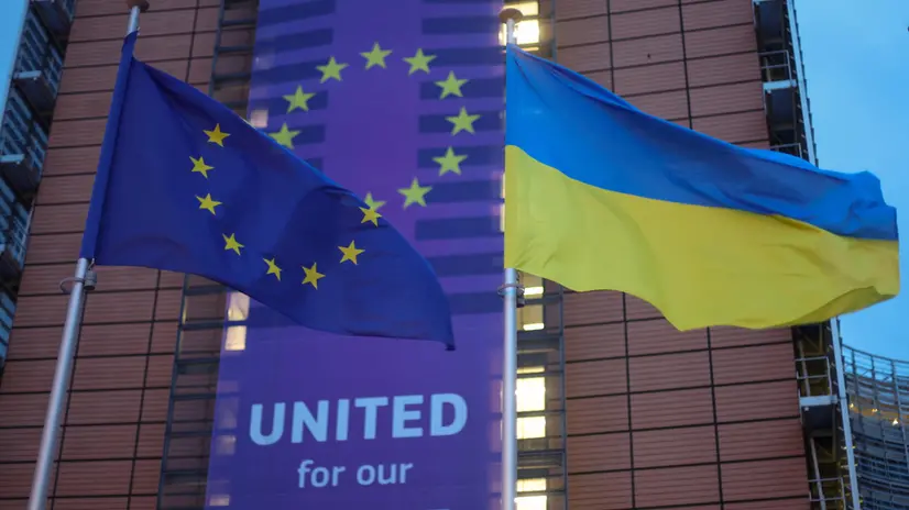 epaselect epa11920526 A view of European and Ukrainian flags in front of the European Union (EU) institution headquarters during an EU Foreign Affairs Council meeting in Brussels, Belgium, 24 February 2025. On the third anniversary of Russia's full-scale invasion of Ukraine, EU Foreign Affairs Ministers will discuss Russia's aggression against Ukraine. EPA/OLIVIER HOSLET