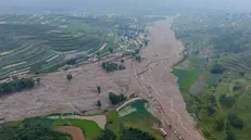 epa12292017 An aerial photo taken with a drone shows the mountain torrents-affected area in Maliantan, Yuzhong County, Gansu Province, China, 09 August 2025 (issued 10 August 2025). Mountain torrents left over a dozen dead and some 30 missing, provincial emergency authorities said. EPA/XINHUA / Lang Bingbing CHINA OUT / UK AND IRELAND OUT / MANDATORY CREDIT EDITORIAL USE ONLY