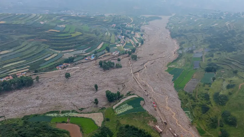 epa12292017 An aerial photo taken with a drone shows the mountain torrents-affected area in Maliantan, Yuzhong County, Gansu Province, China, 09 August 2025 (issued 10 August 2025). Mountain torrents left over a dozen dead and some 30 missing, provincial emergency authorities said. EPA/XINHUA / Lang Bingbing CHINA OUT / UK AND IRELAND OUT / MANDATORY CREDIT EDITORIAL USE ONLY