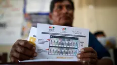 epa12305587 A person takes part in a training session organized by the Departmental Electoral Tribunal (TED) in Villa Tunari, Bolivia, 16 August 2025. At the San Antonio School, the largest polling station set up in Villa Tunari, the ballot boxes are already under custody, and final training is being provided to notaries and electoral jurors, who will be responsible for recording the votes. Bolivians will head to the polls on 17 August to elect a new government and parliament for the next five years, in general elections that could signal a political shift toward the center or right after 20 years of dominance by the leftist Movement for Socialism (MAS) governments. EPA/Rodrigo Sura