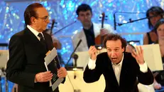 Pippo Baudo con Roberto Benigni - Ansa © www.giornaledibrescia.it