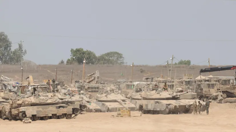 epa12294761 Israeli armored vehicles seen near the Gaza Border, in southern Israel, 12 August 2025. Over 61,400 Palestinians have been killed in the Gaza Strip since October 2023, according to the Palestinian Ministry of Health, and about 1,200 Israelis have been killed since the launch of an Israeli military campaign in response to a cross-border attack by Hamas on 07 October 2023 EPA/ABIR SULTAN