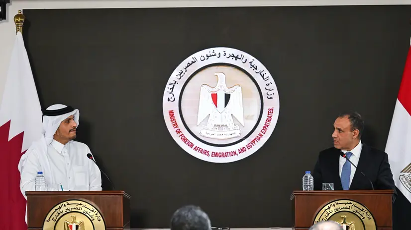 epa11743811 Qatar's Prime Minister, Foreign Minister Mohammed bin Abdulrahman bin Jassim Al Thani (L), and Egyptian Minster of Foreign Affairs Badr Abdelatty (R), speak during a joint press conference after their meeting in the new administrative capital in Cairo, Egypt, 27 November 2024. EPA/MOHAMED HOSSAM