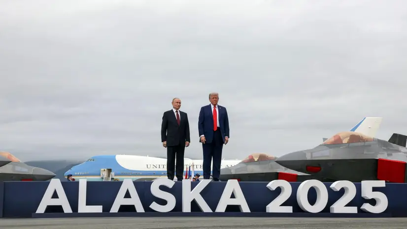 epa12303631 US President Donald Trump (R) and Russian President Vladimir Putin pose on the podium on the tarmac after they arrived to attend a meeting at Joint Base Elmendorf-Richardson in Anchorage, Alaska, USA, 15 August 2025. EPA/GAVRIIL GRIGOROV/SPUTNIK/KREMLIN POOL / POOL MANDATORY CREDIT