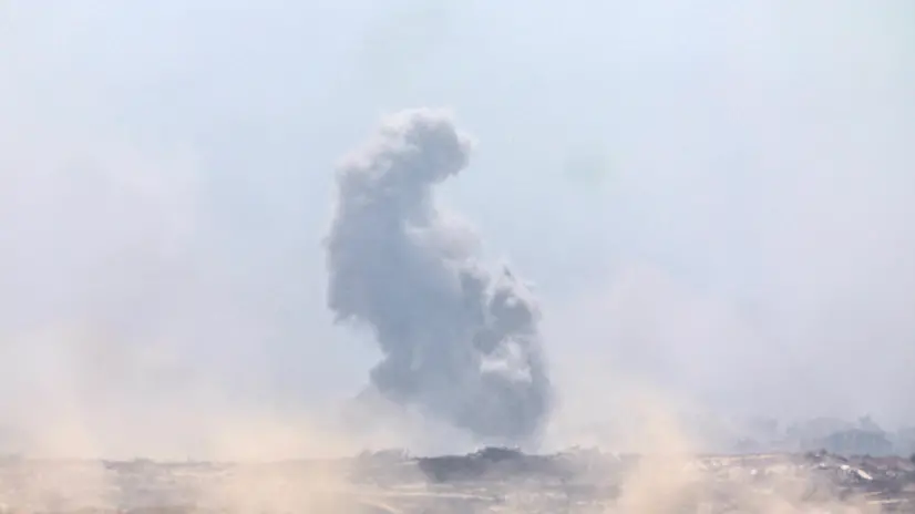epa12271054 Smoke rises as a result of an Israeli airstrike in the northern part of the Gaza Strip, near Gaza City, as seen from the Israeli side of the Israel-Gaza border, 29 July 2025. EPA/ATEF SAFADI