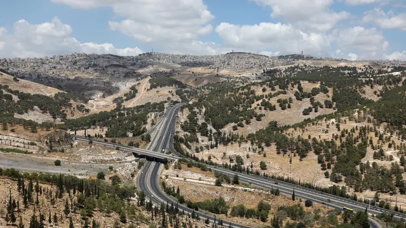 epa08510152 A general view the E1 road leading from the Israeli settlement of Ma'aleh Adumim to Jerusalem, in the West Bank, 19 June 2020 (issued 26 June 2020). The Israeli government plans to extend its control over the West Bank by annexing more than 200 Israeli settlements from 1 July, a move that has been widely condemned by the international community apart from the US-backed plan, which US president Donald Trump and Israeli prime minister Benjamin Netanyahu have called â€˜the deal of the centuryâ€™. EPA/ABIR SULTAN ATTENTION: This Image is part of a PHOTO SET