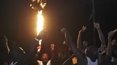 epa04702707 Nigerians jubilate over the declaration of Dayrius Ishaku as the winner of the governorship election in Jalingo, Taraba state, Nigeria, 13 April 2015. With results of the 29 governorships and 36 state assemblies still being counted the All Progressives Congress (APC), the party of Nigeria's incoming president, has already retained key areas such as Lagos and gained northern states Kaduna and Katsina. EPA/GEORGE ESIRI